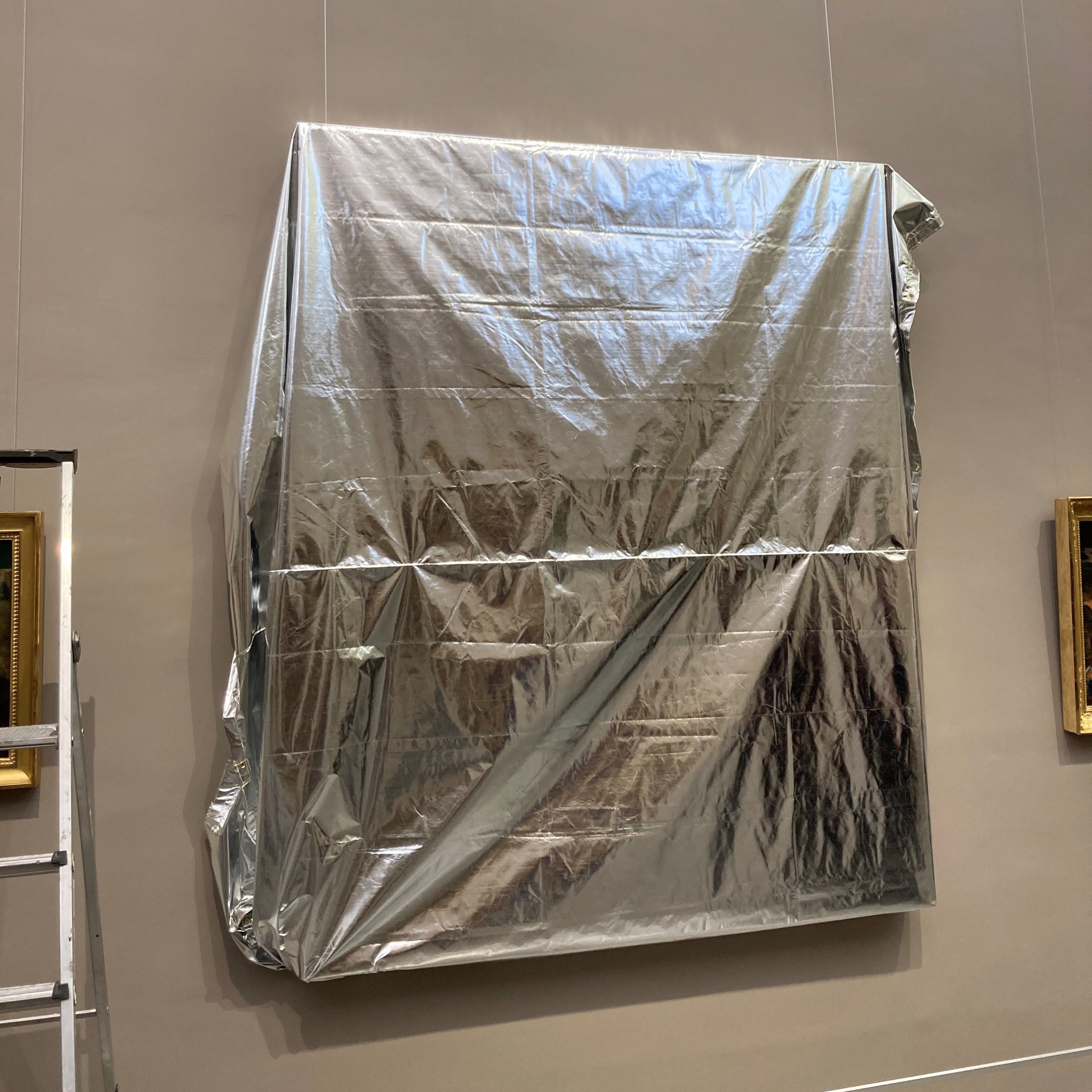 Fireguard radiant heat cover protecting a painting against fire in a museum