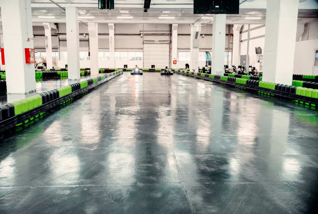 Rubber flooring with release liners at a kart track